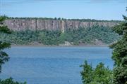 Have you ever stood spellbound by the astounding beauty of the Hudson River and the Palisade cliffs that line the western side? Can you imagine waking up to this vision of beauty everyday? Wouldn&rsquo;t it be great to entertain your friends and family on your private deck as the sun sets over this vista? Updated and cozy, this home is convenient to all that Hastings on Hudson has to offer. Please make an appointment today! Additional Information: ParkingFeatures:1 Car Attached,