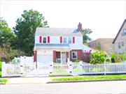 Welcome to this 3 large bedrooms 1 1/2 bath Colonial home. On the first floor, you will find a formal dinning and living room with wood burning fireplace. In addition, it offers a screened in den for all four seasons. There is also a basement with a separate entrance.