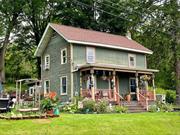 This delightful 3-bedroom, 2-bathroom farmhouse is nestled in Ancram&rsquo;s historic district, offering a mix of coziness and allure. A welcoming front porch with rocking chairs opens to a roomy living area and a large country-style kitchen equipped with stainless steel appliances, granite countertops, a pantry, radiant floor heating, and a wood-burning stove. The ground floor also features a full bathroom, a mudroom, and a storage/workroom. The second floor houses the main bedroom with an ensuite bathroom and laundry facilities, as well as two more bedrooms. The vast backyard is ideal for leisure or hosting gatherings. Situated in a handy hamlet, the property is near the Post Office, various dining spots, a town park, an Arts Center, and a community pool. It is eligible for the New York State Historic Homeownership Credit and is offered for sale in As-Is condition. Additionally, it is conveniently located near the Taconic State Parkway, Millerton, Pine Plains, Hudson, NY, and the Berkshires. Additional Information: HeatingFuel:Oil Above Ground,