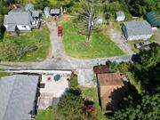 Charming cottage with a cozy country vibe, tucked away on a quiet dead-end road just minutes from the village. Enjoy privacy while still being close to shops, restaurants, Ellenville Regional Hospital, and the Catskill Resorts Casino.  There is a partially covered deck upon entrance to the home, as well as a private porch area attached to the bedroom. Sneak away to the walkway that leads to a rear patio, which wraps around the back of the house. A perfect place for opening a book, taking an afternoon nap, or tending to a garden! The 2-car garage provides ample space for more than just vehicles.