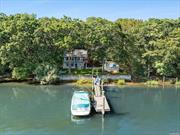 Introducing a unique waterfront property to the market for the first time: an exceptional treasure with an unprecedented 228+/- feet of water frontage in the sought-after Redwood Island neighborhood of Sag Harbor Village. This south-facing, partially bulkheaded lot offers breathtaking panoramic views of Sag Harbor Cove and features a private dock equipped with a jet ski lift, accommodating multiple boats for convenient access to the Village and the Bay. The charming nautical-themed cottage boasts a charming eat-in kitchen with a tin ceiling, a cozy living room with a fireplace, 3 bedrooms, 2 bathrooms, a detached garage, and a covered deck and patio - ideal for relaxing and enjoying the expansive water views. Explore the potential of this extremely rare, double-wide waterfront opportunity, just a mile from Sag Harbor Village&rsquo;s year-round activities.