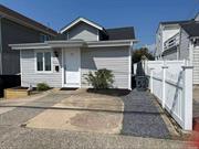 Bungalow in front has Eat in Kitchen, living room, laundry room, one full bath and one 1/2 bath, 2 bedrooms, loft bedroom with living area. --- Separate Cottage behind Bungalow, Studio, Efficiency Kitchen, living room, full bathroom, garage attached. Driveway. New Roofs one layer, new siding on Bungalow. Separate Meters.There is no flood insurance. Being Sold As IS.