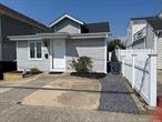 Bungalow in front has Eat in Kitchen, living room, laundry room, one full bath and one 1/2 bath, 2 bedrooms, loft bedroom with living area. --- Separate Cottage behind Bungalow, Studio, Efficiency Kitchen, living room, full bathroom, garage attached. Driveway. New Roofs one layer, new siding on Bungalow. Separate Meters.There is no flood insurance. Being Sold As IS.