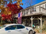 Originally a Firehouse and Town Police Station! Everything is CO&rsquo;d at this 2 Story Building. On the 1st floor you&rsquo;ll find 3 storefronts all which could be connected and a 1/2 Bath. Upstairs there is a tremendous loft Studio space prime for an artist with wood flooring throughout, soaring ceilings, a Full Bath and Balconies overlooking downtown Sound Beach. This building has gas heating. In the yard you will also see a 2 Car detached garage. Come explore the opportunities!