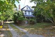 Nestled on 1.4 Acres, this Charming Victorian home boasts approx. 2500 Sq Ft of potential. With its intricate woodwork, Gable roof lines The property captures the elegance of a bygone era. Inside High Ceilings, Original hardwood floors throughout, and vintage details await restoration to their former glory. The expansive grounds offer endless possibilities, including a two-stall barn perfect for horses, Hobbies, or storage. Additionally, the property offers room for a potential riding ring, or a unique opportunity for a possible subdivision, providing a chance for future development or investment. This home is a canvas for your vision, requiring work but brimming with Historic Charm and Potential.