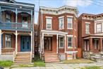 Now offering investment property in the Historic District of the City of Newburgh. Beautiful brick row house style building with covered front porch and entry foyer. The house has been updated while retaining some of the original character of the building including staircase and handrails/newel post, a claw-foot tub and fireplaces (non-functioning). Large rooms throughout. Each unit has a big kitchen with room for a table, spacious bathroom and a back porch that spans the entire building. Nice fenced yard. With 2 boilers, tenants pay their own heat and also electric. Part of the walk-out basement has been compartmentalized. Live in one apartment and rent the other! Alternately, convert this back to a great one family home! Close to shops and restaurants. A short distance to the Beacon train to NYC and major highways.