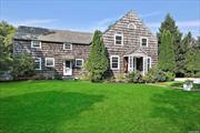 QUOGUE SOUTH OFF-SEASON RENTAL Hidden away down a leafy driveway, this lovely shingle-style 4 BR, 4.5 BA is just a short distance to everything in Quogue. The first floor features an enormous wood-beamed great room with fireplace; eat-in kitchen; laundry room; den; and 1.5 baths. Upstairs is a primary suite with walk-in closet and renovated bath; two twin bedrooms; one queen bedroom, and 2 full guest baths. Outside is a detached garage, spacious back yard, and heated pool. The ideal off-season getaway!