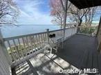 Stunning Year round Water views from this 2 bedroom Apartment. Watch the Sunset from your private Balcony. Unique Carved wooden doors throughout. Updated Kitchen. Lots of storage space. Shared washer and dryer. Walk to Beach, Village Of Sea Cliff.