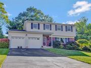 Spacious colonial home features 4 bedrooms & 2.5 baths. Formal Entry boasts engineered hardwood floors. Formal Living room is adorned with a large picture window, crown molding, & hardwood floors. Formal Dining room features hardwood floors, chair rail, & crown molding. Eat-in kitchen has granite counters, marble backsplash, recessed lighting, natural cherry cabinets & penninsula. Sliders lead to rear yard. Family Room off Kitchen. 1st floor also includes a renovated lavatory, laundry room, access to 2 car garage & side yard. Master bedroom has a walk-in closet, and the master bath includes a stand-up shower and jacuzzi tub. Bedroom 2 features 2 double closets, hardwood floors, while Bedroom 3 offers hardwood floors & a double closet. Bedroom 4 has access to attic storage. Main bath includes a double vanity and tiled tub. The partially finished basement provides built-in shelving & ample storage. Outside, you can enjoy the fenced-in inground pool, & the benefits of solar panels.