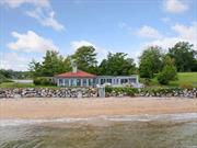 Wonderful Beachfront Bungalow With 360 Degree Water Views. Perfect Long Island Waterfront Retreat. 4 Bedrooms and 4 Bathrooms with a Renovated Kitchen and Hardwood Floors. This Beautiful, Fully Redesigned Rental Boasts New Interiors and A Freshly Installed Beachside Deck, Great for Entertaining Outdoors or Viewing Sunsets.