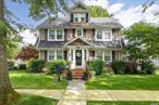 **BACK ON MARKET AFTER A HOLIDAY BREAK **Class and style abound as you enter this stately 5 bedroom, 2.5 bath Dutch Colonial Revival built in 1927, with an addition circa 1951. The home has been meticulously maintained; old world charm meets modern day amenities, not a detail overlooked! White oak floors with double mahogany inlay throughout accent the substantial formal living room, centered around a natural gas fireplace with original onyx hearth from the 1920s. Adjacent to the living room is a sunroom offering a bounty of natural light. The elegant formal dining room, reached through a roomy foyer, leads to a nice-sized, updated eat in kitchen with pantry. The immense family room features a cathedral ceiling, plenty of windows, a powder room, and access to the attractive backyard, perfect for entertaining! The second floor comprises all the contemporary conveniences such as a washer/dryer, cedar storage, an exquisitely remodeled bath with oversized jacuzzi tub, and three of the five bedrooms. The primary has an ensuite, three closets, and additional storage within a beautiful window seat. The third floor contains the remaining two bedrooms and provides even more storage. The home is set forward on its plot to maximize the park-like property with ornate, mature trees, a sizable bluestone patio, and a detached two car garage. There is an 1, 800 square foot unfinished basement as well offering endless possibilities. All renovations were completed with the integrity of the home in mind. This is a special opportunity in the desirable Seaford Manor neighborhood. Truly one of a kind!, Additional information: Appearance:Mint, Cooling:High Pressure System, Separate Hotwater Heater:Yes