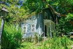 A quaint antique home the hamlet ofGallatinville, NY. This 1820 home on .68 acres is loaded with quirky charm. With vintage wallpaper, lots of built-in cabinets and bookshelves, the 3-bedroom 1-bath house is as homey as they get. From the glassed-in porch, you step into a cozy entry hall, then into a large dining room. The country kitchen and comfortable living room with wood burning fireplace insert are off the dining room, and the bathroom is on the ground floor too. Upstairs are three bedrooms and a sitting area that can be converted to a bath or furnished as a library or study. In the shade of the trees surrounding the house are a patio, an old root cellar, a stone barbecue and a raised bed vegetable garden. A two-car garage is tucked into the hillside and there&rsquo;s ample parking for additional cars. Once lovingly landscaped, the property has been little-used for a couple of years, but a little care will bring the gardens back to life. Come check it out! Additional Information: ParkingFeatures:2 Car Detached,