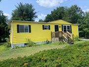 A bright and cheerful two-bedroom, one bath ranch in a popular lake community in the Hudson Valley! Get your full-time home or weekend getaway in the private community around Robinson Pond in Copake, New York. With an attached one-car garage, a pleasant deck overlooking a quiet back yard, this surprisingly roomy manufactured home has a large living room, dining area, efficient galley kitchen with laundry, two good-sized bedrooms with ample closets, and a large bathroom. The oversized attached garage has plenty of room for a car and storage, and there&rsquo;s a full basement, too. A short walk to the community amenities (beach, ball field, park), this home has all that one needs for easy living year-round. Close to the nearby towns of Hillsdale, Great Barrington, Millerton and Hudson, there are hiking trails, farmers markets, restaurants and antique store all within reach of this home, and all within a couple of hours of New York City.