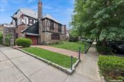 Styled with the romantic elegance and nestled in a picturesque setting, this Spacious English Tudor combines the classic allure of exquisite architecture with refined sophistication of French-inspired design. The storybook facade captivates with its steeply pitched rooflines, decorative half-timbering, & striking stonework. Charming arched doorways, leaded glass windows, and beautifully detailed masonry with original wood doors adorned with antique-style hardware, including large, ornamental hinges and door handles made from wrought iron or brass. The high ceilings enhance the sense of space and grandeur, making a powerful first impression in every room throughout the home. A Welcoming Front Door is adorned with decorative elements elaborate wrought-iron accents, and window of leaded glass inserts, which is characterized by small, diamond-shaped panes set within lead cames. This not only allows for privacy and filtered light but also adds a distinctive, period-appropriate element to the entryway the Stunning Rotunda Foyer with round dome high ceiling lit by Iron Grand Chandelier like no other! Walking through another hallway with closets,  you are then greeted by a beautiful Grand Foyer Staircase. An inviting living room features a majestic stone fireplace and exposed Wood beam ceilings, original hardwood Floors that resonate elegance and sophistication. The formal dining room is a showcase of detailed craftsmanship, perfect for hosting elegant dinners and special gatherings. Graceful arches introduce an additional room with pantry and a kitchen of form & function with high-end master chef Viking Stove. An adjacent intimate dining room with large windows creates perfect environment for morning coffee or casual dining.The powder room for guests is designed with a nod to timeless beauty of mosaic windows and stunning flooring. Second Floor is introduced by the grand foyer staircase large hallway with high ceilings and handcrafted chandelier that leads to 3 three generously sized bedrooms, each offering a unique blend of elegance and comfort. The primary suite is a true retreat, with an adjacent additional room for ample space and a serene atmosphere. Again the high ceilings with beautiful chair rail designs only enhance your bedroom! A Second full Bathroom radiates more of Old-world charm while your foyer offers more closets. Step out onto your Balcony of soft lighting and enjoy your wine and morning or evening serene moments, overlooking your lovely landscaped yard, and a view of storybook of stone walls shed.  A Large Full Finished Basement is left to your imagination with its high ceilings, additional rooms, & faux fireplace. A walk up full finished spacious attic has finished flooring, high ceilings, large windows, and a radiator. A stone archway leads to Backyard. Home has one car garage and private driveway. Close to Shopping, Transportation, Schools, and Parks...