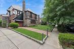This stunning English Tudor, set in a picturesque location, and sits on 60x100 lot size, blends classic architectural charm with French-inspired sophistication. The exterior features steep rooflines, decorative half-timbering, and striking stonework, complemented by arched doorways, leaded glass windows, and original wood doors with antique-style hardware. High ceilings throughout the home create a sense of grandeur.The welcoming front door, with its wrought iron accents and leaded glass, opens to a magnificent rotunda foyer, highlighted by an ornate iron chandelier. The elegant living room boasts a majestic stone fireplace and exposed wood beams, while original hardwood floors add timeless appeal. The formal dining room showcases exquisite craftsmanship, ideal for hosting elegant gatherings.The kitchen is both functional and stylish, featuring a Viking stove and an adjacent dining nook with large windows. A guest powder room with mosaic windows and stunning flooring adds charm.The second floor, accessed by the grand staircase, leads to three spacious bedrooms, including a primary suite with an additional room for extra space. The second bathroom exudes old-world charm. A balcony off the bedroom overlooks a beautifully landscaped yard, stone walls, and a shed.The large finished basement offers high ceilings and additional rooms, while the attic, with its finished floors and ample light, is a versatile space. A stone archway leads to the backyard, which includes a one-car garage and private driveway. Conveniently located near shopping, transportation, schools, and parks.