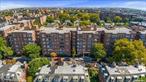 Located in the historic district of Jackson Heights, apartment 5O at The Carlton House is a spacious 2-bedroom corner unit offering over 1, 000 square feet of living space and a private terrace overlooking a peaceful tree-lined street. Upon entry, you&rsquo;ll be greeted by a large foyer that can serve as a formal dining room or home office, leading into the living room, which opens to your private terrace - an ideal spot to relax and enjoy the outdoors. The primary bedroom features two closets, two windows, and comfortably accommodates a king-sized bed with additional furniture. The bathroom, which has a window, includes a bathtub and is accessible from both the second bedroom and the hallway. The windowed eat-in kitchen provides plenty of room for a dining table. The Carlton House offers a range of amenities, including a part-time doorman (4 pm to midnight), a common garden, on-site garage (with a short waitlist), a gym, a bike room, and a common laundry facility. The neighborhood is conveniently located near cafes, restaurants, shops, supermarkets, schools, and public transportation. Parking is available, though currently on a short waitlist.