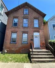 Classic brick home in the heart of Beacon, steps from the best of Main Street&rsquo;s restaurants and shops. This three bedroom and one bathroom home has newer water heater and boiler, arched brick windows, walk-up attic perfect for studio or storage, and views of Mount Beacon from the back yard. House needs work but has a lot of potential. Transition zoning designation allows for residential or commercial use.