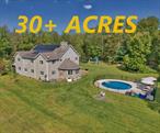 Discover the essence of Hudson Valley living with this extraordinary property! Nestled in a serene, wooded landscape, this home has almost 5, 000 sqf, 5 bedrooms, 3 bathrooms, 2 bonus rooms (use as gym, 2nd office, etc.) and an office. This contemporary home offers unparalleled privacy and a canvas to create your dream lifestyle. Enjoy breathtaking sunrises and sunsets with perfect lighting throughout the day on over 30+ acres that beautifully showcase each seasonâ€™s charm. The property features meandering creeks, streams, a pond, and a network of ATV and hiking trails. Walk into the breathtaking foyer where you will see the double staircase, an open living area and a floor to ceiling stone double sided fireplace. The kitchen is equipped with dual wall ovens, granite countertops, and a sprawling 7.5-foot island with ample counter space. Two expansive decks provide therapeutic views, perfect for relaxation. Inside, you will find custom flooring with vaulted ceilings throughout. The primary bedroom is a sanctuary which includes vaulted ceilings, skylights, two generous walk-in closets, private balcony and a luxurious bathroom. Eco-friendly features include an outdoor wood burner for additional warmth and solar panels to reduce energy costs. The fenced-in pool is surrounded by a stone patio, creating an ideal outdoor retreat. The spacious unfinished basement boasts 10-foot ceilings, offering ample storage or potential for additional living space. A scenic 1000-foot driveway provides a perfect blend of seclusion and proximity to town. Thinking about opening a Montessori, preschool, making a homestead, nature care, community center or small retirement home this home has the size and lot size. Donâ€™t miss the chance to experience this remarkable estate. Close to NYC trains and I-84, schedule your viewing soon! Additional Information: Amenities:Storage,