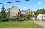 This stunning two-story home is on an 85 X 110 sq ft lot in the family-friendly neighborhood of Woodmere. From the open-concept kitchen and living space to the large backyard, there is plenty of room to enjoy. With 6 bedrooms, you have the flexibility to use this space as bedrooms, a home office, a children&rsquo;s playroom, a guest room - anything to accommodate your needs. Each bedroom has a large built in closet, with the master bedroom boasting two full walk-in closets. You will find tasteful updates throughout this luxurious home, including the 3.5 bathrooms conveniently located throughout the house. The 2 kitchens, 2 living rooms, and dining area make the perfect setting for either entertaining or some quiet relaxation time. Large windows in every room allow for an abundance of natural light, giving the home an airy and warm feel. The home offers a stand-in attic with flooring, a garage, and a large separate shed for even more storage space. Following the lush landscaping to the spacious backyard where you will be met with your perfect vacation area containing a large patio, a full-sized deck, and a semi-in ground vinyl pool. Central AC with 2 zones, natural gas, a prime location near shops, restaurants, train, and parks - Don&rsquo;t miss the chance to make this yours!, Additional information: Appearance:Excellent, Interior Features:Guest Quarters, Lr/Dr, Separate HotwaterHeater:Yes