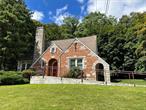 Tudor Style Medical Office for Rent. The Space Includes a Large Reception/Waiting Area with Glass Window. Large Back Area with Sink. Three Exam Rooms/with Sinks. A Bathroom and a Large Front Office. Plenty of Parking (11 Spaces) and is Handicap Accessible. Located on Peekskill Hollow Road.