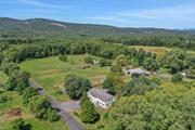 Welcome to a captivating horse farm estate nestled on 19 pristine acres in the picturesque town of New Paltz. This stunning property offers a harmonious blend of modern luxury and rustic charm, ideal for equestrian enthusiasts and nature lovers alike. The Main Farmhouse: The centerpiece of this estate is a fully renovated 1850 square-foot farmhouse. Impeccably updated to meet contemporary standards, this home combines comfort with style while preserving its classic character. Enjoy breathtaking mountain views and the serene beauty of the Wallkill River from your doorstep, creating a perfect backdrop for peaceful living. Equestrian Facilities: The property features multiple stables and a spacious pole barn, catering to all your horse-keeping needs. Whether you&rsquo;re housing a small herd or require ample space for equipment and supplies, these well-maintained structures provide functionality and ease. Guest Accommodations: In addition to the main farmhouse, a thoughtfully redone manufactured home is available for guests or farm handlers. This secondary residence ensures that everyone has a comfortable place to stay, making it an ideal setup for hosting visitors or managing farm operations. Land and Infrastructure: The entire property is surrounded by new fencing, enhancing both security and aesthetic appeal. Beneath the fencing, a sophisticated irrigation system keeps the land lush and vibrant, ensuring optimal conditions for both pastures and gardens. Embrace the ultimate lifestyle on this exceptional horse farm, where every detail has been meticulously crafted to offer a blend of luxury, functionality, and natural beauty. Whether you&rsquo;re an avid equestrian or simply seeking a tranquil retreat, this New Paltz gem is a rare find that promises to exceed your expectations.