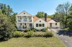 This 4 bedroom, 3 bath home originally built In 1950 and recently renovated in 2022 offers stunning Catskill Mountain views. The second floor is dedicated entirely to a primary suite with private deck designed to capture encompassing Catskill and sunset views. The kitchen renovated in 2018 anchors the dining room and the living room with a wood burning fireplace and picture window facing west; open concept but with designated spaces. Across from the great room are 2 bedrooms and a full bath, a family room / den plus an office space. The lower level offers a comfortable finished space which could be used as a family room, media or exercise room and also has a full bath and laundry room. Two doors access the back patio from the lower level ideal to offer privacy for guests allowing them to come and go at their own discretion. A total of 3, 580 finished square feet on just under 5 acres, close to the Villages of Red Hook and Rhinebeck but on a less travelled county road.