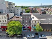 Located in Poughkeepsie Central Business District, this 4-story mixed-use building has slowly undergone renovations over the past 10 years by the owner and prior ground-floor tenant. Building features two commercial units (ground-floor lounge, 2nd floor tattoo parlor) and two residential units (3rd floor 2BR, 4th floor 2BR) with a full basement, fully occupied, relatively new tenants with short-term leases (1-3 years). Updates include a new roof in 2021, separated electric/gas/water meters and window A/C units.