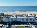 Experience coastal living at its finest with this stunning direct oceanfront home. This beautifully appointed 1-bedroom / Junior 4 unit offers an unobstructed view of the shimmering ocean from the bedroom, living room, and your private balcony. Imagine starting and ending your days with the soothing sounds and sights of the ocean right outside your door. The spacious bedroom features an oversized walk-in closet, providing ample storage space. Pamper yourself in the luxurious full bathroom, complete with a jet tub for ultimate relaxation. The modern kitchen has all-new appliances. Convenience is key with a dedicated garage parking spot included, ensuring both security and ease of access. Residents can enjoy a resort-like lifestyle with exceptional amenities, including an outdoor pool, a fully-equipped gym, bike storage, and a community room perfect for social gatherings. Do not miss out on this rare opportunity to own a piece of paradise.