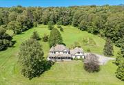 A farmhouse in a bucolic setting is what many envision as fine country living in the beautiful Hudson Valley. Situated off a scenic country road in the Town of Lagrange, this property offers a wonderful landscape of natural beauty and privacy. The home is sited on a pastoral knoll, surrounded by a 160+ acre farm in conservation, overlooking sweeping meadows where one will be captivated by views of the rich, protected farmland. This builder&rsquo;s own home is a warm and comfortable retreat and boasts fine details inside and out. A wall of windows and a wood-burning fireplace fill the inviting family room with light and warmth. A lovely music room with a bank of windows overlooks the picturesque land and a dining room with a coffered ceiling and a custom built-in cabinet is sure to please. The kitchen and dining area extend outdoors to a stone patio. The second floor offers a primary bedroom en suite, two additional bedrooms, and another full bath. There is an expansive covered front porch, the perfect place to enjoy a gorgeous, protected view. An unfinished basement and attached three-car garage with walk-up second floor space offer an abundance of storage space. This beautiful, serene setting is landscaped with attractive gardens and there is a small barn, your chickens will love! Convenient location to enjoy the Town of Lagrange parks and recreation. Located just a short drive from the Village of Millbrook and close to the Taconic State Parkway, as well as the many local attractions in the scenic Dutchess County.