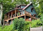 Heavenly lakefront, unique, seasonal contemporary home, a stand alone cabin on it&rsquo;s own share of land, lot #20, with high end custom features and extraordinary rustic beauty, character & charm with no expense spared in upgrades since it was rebuilt in 2010 with lakefront on 209 acre Pleasure Lake, to experience fantastic fishing, swimming, boating with 4 hp max or electric , sailing, canoeing , paddle boarding , kayaking & much more. It features a dramatic open floor plan, high ceilings, knotty pine interior with 100 year old beams, tongue & grove floors, gourmet kitchen with center island & custom built in cabinetry, and abounding with artistic accents throughout. There is an amazing 1st floor primary bedroom & full bath, fabulous great room with lovely propane fireplace and bluestone hearth, for the ease of one level living on the 1st level & 2 bedrooms & full bath with balcony overlook upstairs and can be sold mostly furnished.There are also many wonderful both on and close by off sight activities and events including winter ones offered and club organized. Be enthralled by such a wonderful view of the lake from an enclosed front porch. You have your own dock, floating dock & boat rack and fire pit. The property is owned by a private Fishing and Boating Club, established over 100 years ago and what is being sold is a share in club that gives the purchaser rights to occupy lot 20 , pending club approval of purchaser, membership application, background check, and financial review. Since the club is private, all showings must be accompanied by the owner or agent and no unscheduled drive bys or entry. and visitors must not enter the property except to gain access for the sale.This gated, private club owns a total of 463 acres, including the lake, fields, woods, streams, jogging, hiking and biking trails. You can ice fish or skate.It is an inspirational refuge from the stress of life, to relax and appreciate the beauty, serenity and to commune with nature, or entertain & enjoy the many pleasures of the lake. All of this yet it&rsquo;s close to shopping, Route 17 , Resort World Casino, Bethel Performing Arts Center, Monticello Raceway & approx 2 hrs. to NYC. You will just love being there.It&rsquo;s Shangri-La!