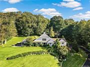 Welcome to this exceptional 4-bedroom residence in the heart of Chappaqua, nestled within the sought-after Lawrence Farms East neighborhood. This beautifully renovated home perfectly balances modern elegance and comfort, making it a true gem in the Chappaqua school district. As you enter, you&rsquo;ll be captivated by the grand foyer, showcasing a striking staircase and soaring cathedral ceilings that set the stage for the home&rsquo;s sophisticated style. The open and flexible floor plan ensures a seamless flow, enhanced by an abundance of natural light pouring in through walls of picture windows that frame the breathtaking surroundings. Amongst the special spaces in this home is the stunning Chef&rsquo;s kitchen, featuring stainless appliances including two Miele dishwashers, a center island with seating, a convenient desk area, and a spacious eating nook. This space opens gracefully to both the expansive family room and the light-filled living and dining rooms, creating a perfect environment for entertaining and everyday living. The luxurious second floor primary bedroom suite with spectacular views offers a serene retreat, while the home offers the rare convenience of an additional first floor primary bedroom suite. In addition, large bedrooms and versatile spaces throughout the home provide ample room for home offices, play areas, or relaxation spots to suit your unique needs. Set on 1.46 acres of fully landscaped grounds, this property offers an unparalleled outdoor living experience. The oversized slate patio and expansive covered porch, complete with a fireplace, grill, and dining area, is ideal for hosting gatherings and outdoor entertaining, with panoramic sunset views that will leave your guests in awe. This home is designed for those who appreciate both luxury and functionality, with hardwood floors, three fireplaces, walls of windows, recessed lighting, tons of storage, and top-of-the-line finishes throughout. The impressive paved driveway adds to the home&rsquo;s curb appeal. Don&rsquo;t miss this opportunity to own a stunning property in one of Chappaqua&rsquo;s most desirable neighborhoods. Experience the perfect blend of modern living and natural beauty in this wonderful offering!