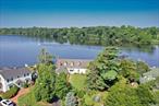 Peaceful four bedroom Idle Hour two story home in Oakdale on the Connetquot river. Serene direct west coast sunset views of the historic, picturesque, Bayard Cutting Arboretum from the backyard across the river. Brand new white kitchen perfect for entertaining with Dacor stovetop, oven, microwave and warming drawer. Taj Mahal quartzite countertops. Kitchen opens up to a den/sitting area with gas fireplace and access to the expansive stone patio. Formal dining room with beautiful brass chandelier, large living room and powder room complete the entertaining space on this level. Entire first level has radiant heat stone floors and a built in Bose speaker system. This house has two oversized primary bedroom options, the first of which is on the main level with an en suite full bathroom, slider to the patio and direct access to the laundry with brand new Samsung washer and dryer. The first bedroom on the second level has a cedar closet and another huge closet that could be turned in to an ensuite bathroom. Large middle bedroom with built ins currently used as office. Third bedroom is huge with two walk-in closets. Full bath just outside this bedroom. Bonus office space off the kitchen. Two car garage with pull down stairs for additional storage option. Cruise the river for a long boating season and dock your boat in a 40ft cut in boat slip plus173&rsquo; Bulkhead. Down the river is the Idle Hour Beach Club w/swimming pools and club house membership for Idle Hour residents only. You will also have easy access to several fine culinary destinations and large Marinas, live music and fun all summer long. Oakdale is also flanked by 2 Premier Bayfront Golf Courses just minutes away. Fantastic fishing grounds, Fire Island, Sailing, Clamming, Crabbing, Canal hoping and more. Come and see this private waterfront paradise today., Additional information: Appearance:Mint, Green Features:Insulated Doors