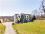 HUDSON VALLEY HORSE FARM in Chester, NY with award winning Goshen Schools. Expansive and dramatic views of farm situated on 30 acres with 5 huge paddocks, two with run in sheds. A spacious 7 stall horse barn with tack room and center aisle, professionally installed sand riding arena, water spigots at paddocks, fenced in back yard overlooking an idyllic pond with pump and filtration. Imagine gazing out back at the horses, the sparkling pond and spectacular views from your the deck of your expansive modern colonial home with huge deck. In addition to the primary living space, this welcoming home offers a full 1200 sf walk out basement with full bath, second kitchen and office. The best part of this house is the sunny light filled rooms the every changing views. Woodbury Common, Lego Land, hospitals, schools and public transportation to NYC. This is a special opportunity!