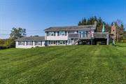 This scenic raised ranch sits on 1 well manicured acre with picturesque views of the Beaverkill Valley and Catskills. On a clear day, 3 states are visible spanning over 50+ miles of beautiful terrain. The open-concept common areas create a perfect space for family gatherings and entertaining. The kitchen features granite countertops, stainless steel appliances, and an island with electric. Located on the first floor are three bedrooms and a full bathroom with custom tile work from floor to ceiling. The primary bedroom with en-suite features tasteful updates. The cozy lower level showcases beautiful stonework and a wood-burning fireplace, perfect for cooler months. During the warmer seasons enjoy breathtaking views on the expansive deck while barbecuing on the custom stone barbecue. Additional features include an oversized 3-car garage and shed for ample storage. Conveniently located just two hours from NYC and a short drive to the charming Main Street of Livingston Manor.