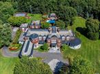 Nestled on a meticulously landscaped 6-acre+ property, 11 Dupont Court epitomizes architectural sophistication and resplendence. This stately Brookville Brick Colonial, constructed in 2005, spans over 15, 000 Sq.Ft. and encompasses 7 Bedrooms and 12 Bathrooms. Its graceful design is distinguished by bespoke features such as elaborate woodwork, spiral staircases, marble flooring and soaring two-story ceilings. Natural light is abundant throughout the entire home, flooding through large windows and multiple sets of French doors. The residence&rsquo;s first floor is dedicated to luxurious entertaining spaces, including a formal Living Room and an elegant Dining Room complete with custom cabinetry. The circular Music Room/Conservatory offers beautiful views of the outdoors and the spacious Den is highlighted by a refined limestone fireplace and a two-story gallery mezzanine that overlooks the lower level. The grand eat-in Kitchen is a culinary masterpiece, featuring dual oversized islands, exquisite coffered ceilings, and top-tier Wolf/SubZero appliances. The backsplash is adorned with Delft tile, adding a touch of classic elegance. The Primary Wing on the second floor includes a private office, a generously sized bedroom with a sitting area and fireplace, a large walk-in closet, and a spa-inspired marble bathroom with a soaking tub. The property is enhanced by numerous outdoor terraces, Crestron and Lutron systems, a four-car attached garage, a whole-house generator, a sophisticated surround sound system and more. Approached via automatic front gates, the estate is accessed through a quarter-mile tree-lined driveway. The outdoor amenities are exceptional, including multiple slate patios for entertaining, a sunken tennis court, an outdoor grilling station, a cabana with a kitchenette, and a gunite in-ground pool with a jetted spa. The property is zoned within the esteemed Jericho Union Free School District.