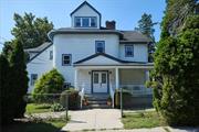 This fabulous Victorian home situated on a corner lot in Lincoln Park/Dunwoodie Heights area represents the epitome of old world charm and character w/ endless potential. The Rocking chair front porch invites you to the vestibule into 2 oversized apartments w/ enormous basement! 1st flr, spacious entry, unique custom designed front (& back) door, handmade by its proud owner & craftsman of 51 years. LR w/ custom wood burning stone fp, floor to beamed ceiling & bay window, lge Primary bdrm/bath w/ vaulted ceiling, sitting area, dble & hidden closets. EIK w/ granite, brick fp, beamed ceiling, access to lndry rm & lge deck to extensive yard that surrounds house. 2 add bdrms, 1 w/ WIC,  full bth, & hallway. Descend to sprawling LL w/ add 1800+ sq ft, not inc in sq ftge! Rec room, open areas, wine cellar/cold rm, wood shop, boiler rm, utilities, storage, bathrm, access to side/backyard & more. 2nd flr unit boasts 2 flrs of bright & airy living oversized EIK w/ pantry and storage nook, bdrm w/ fp, lge LR, bdrm, den/office, full bath up a flight to 2 add. bdrms, bth & den/fam rm, ample closets. Custom fireplaces, custom doors/doorways, Roman arches, wood finishes, extensive storage nooks & closets throughout, vaulted/beamed ceilings, new above ground oil tanks & boiler, 4 car driveway, updated electric, freshly painted! This is a one of a kind home...BEING SOLD AS IS!