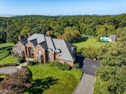 Inspired by the historic manor houses of the Hudson Valley, Sleepy Hill is a hilltop estate on over 10 sprawling acres. Supremely private, the setting is simply beautiful. A 800-foot gated driveway introduces the property and leads to a classic brick colonial. The interior is exquisitely finished-comprising 6 bedrooms, 6 bathrooms, 4 fireplaces and over 9, 000 square feet on three finished levels. The great room, adjacent to the kitchen, is framed by a 2-story barrel ceiling and natural stone fireplace. The garden level, with built-in bar, gym and recreation areas, walks out to a covered terrace. A 100 ft. main terrace commands views of the property, the pool and tennis complex and the hills beyond. On a clear day you can see the Manhattan skyline. Amenities include a wonderful pool house, tennis court and carriage house with studio and 1/2 bath. Located just minutes to the village and the Scarborough Metro North station. Pocantico Hills School District with annual taxes of $55K.