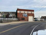 This great investment property is located in the village of East Rockaway. It is a mixed-use building featuring a waterfront commercial space and a spacious four-bedroom, one-bathroom apartment with a terrace overlooking a canal. On the ground floor, a warehouse with a 14x14 overhead door boasting 16-foot ceilings, an office area, and a full bath. Additionally, the property comes with three boat slips and a dock.