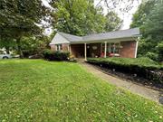 Step into this charming 1, 200 sq ft ranch-style home wrapped in a timeless brick. With 3 bedrooms, 1 bath, kitchen, dining and living room all on one level. This home features hardwood floors, central heating and AC and municipal water and sewer. It is freshly painted and move-in ready. Located a short 12-minute drive to the Beacon Metro North train station and offers easy access to many shopping and dining destinations, including a 10-minute drive to the Newburgh waterfront.  Embrace the opportunity to make this cheerful sanctuary your own a place where timeless charm meets outgoing vibes, creating a life filled with laughter, love, and unforgettable memories.