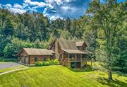 Nestled on just under 3 acres of Catskill Mtn countryside, this fully renovated contemporary log home offers a seamless blend of rustic charm & modern luxury. All hard work & planning has been done for you. Newly remodeled interior boasts a brand new kitchen, equipped w/ solid wood cabinetry, Thermador appliances, & elegant solid surface quartz counters. Kohler & Restoration Hardware finishes, along w/ high-style Mitzi lighting, creates a perfect harmony of form n function. Extensive time & money was invested into making this a completely turnkey offering. Refinished wood flooring compliments the log structural components & other updates throughout. Open plan welcomes you into the 2 story vaulted ceiling living room, which is well lit & airy. The primary bedroom is conveniently located on the main level & features an ensuite full bath w/ tiled shower, providing a private spa-like retreat within your home. Completing the main level is a 1/2 bath & laundry for your convenience. Upstairs offers an additional flex space for relaxation/entertainment. 2 additional beautifully appointed bedrooms & full bath upstairs offer space for home office, family or guests. Full walk-out basement is ripe for transformation, potentially adding an additional 1, 000 sq. ft. of living space, tailoring the home to fit your needs perfectly if desired. The attached 2 car garage w/ high ceilings is currently being used as a workout/fitness area, showcasing the versatility of this property. The exterior is equally impressive, featuring a full front rocking chair porch where you can enjoy your morning coffee while taking in the serene surroundings. Back deck & newly created patio/fire pit area provide perfect spots for entertaining after a day of exploration. This exceptionally sited home is set far back from the road w/ an expansive front lawn, provides a sense of seclusion & privacy that isn&rsquo;t easy to come by these days. Fully enclosed w/ split rail & invisible deer fencing. W/ 2.85 acres, there&rsquo;s a nice mix of lawn & woods, creating a perfect balance of open space & natural forest. This home goes far beyond its visual appeal w/ its extensive list maintenance & upgrades. Exterior log staining/sealing, driveway resurfacing, & comprehensive plumbing n electrical improvements ensure that every aspect of the home is in prime condition. W/ modern conveniences such as a Tesla charger, fresh interior paint, & 4 new Mitsubishi split units, you can move in w/ peace of mind & start enjoying your home immediately. Situated on a town-maintained dead-end road, this modern log cabin offers a serene escape from the daily hustle. Nearby attractions such as Inness, Arrowood Brewery, Westward Orchard, Kelders & Saunderskill Farms provide a rich array of activities & experiences. Quick access to Mohonk Preserve & Minnewaska State Park ensures endless opportunities for outdoor adventures & connecting w/ nature. Whether you are looking for a full-time residence or a weekend getaway, this property provides the best of both worlds.