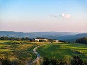 Bordering Amenia and Millbrook, NY this stunning property spans 134 acres, offering absolute privacy with some of the best views in the Hudson Valley. The centerpiece is the 7, 500 square foot main residence completed in 2019, designed by Resolution: 4 offering a seamless blend of modern architecture and the natural beauty of the surrounding landscape. There is a spectacular regulation size polo field with views as far as the eye can see. Divided into two wings by the main entry foyer with a glass pivot door, the first being the service wing: chef&rsquo;s kitchen, pantry, mudroom, and powder room. The entertaining wing features the great room with a black steel surround fireplace, and 70&rsquo; of floor to ceiling glass on the south side. There is a media room with its own fireplace and a clever office space hidden behind a sliding door; a warm space for cozy evenings. A gym is opposite the media room. The main stairs, and an elevator, lead to the second-floor opening to an outdoor entertaining space with a full bar, dining area, and lounge with a wood burning fireplace overlooking the valley. The luxurious and private primary bedroom suite features a wood-burning fireplace with south and east views. There are separate bathrooms; the first offers a freestanding tub set against a full expanse of glass, allowing for uninterrupted views along with an outdoor shower. The second has a stone-clad shower with spa inspired features. The suite is completed by a meditation room with a gas fireplace and two dressing rooms. Three en-suite guest rooms are situated at the opposite end of the hall. The pool house is a retreat unto itself with a kitchen, lounge, and half bath. An outdoor dining area extends into the landscape, creating the perfect spot for dining al fresco. The infinity pool blends into the valley views with space for lounging, an outdoor shower and spa. Connected to the pool house is a three-car garage and courtyard plus a dramatic, tree lined, Belgian block and mossy parking area. The landscape design, by award winning Wagner Hodgson, pays homage to the architectural features. Stone walls and weathered steel elements integrate the terraces and plantings into the landscape. Barns with 48 stalls and multiple paddocks, while currently a polo facility, could make a superb show jumping stable. Gardens, meadows restored with native species, and a croquet court complete this remarkable property. There are two staff houses: one w/ three BR and one w/ two.