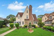 Situated in the coveted Addisleigh Park Historic District, this elegant Tudor-style home combines historic charm with modern comforts. Set on a generous 60x100 lot, the property offers 5 bedrooms, 2.5 bathrooms, additional pluming on 3rd floor for bathroom if needed and a separate office. The home features an eat-in-kitchen, extra-large formal dining room, perfect for hosting large gatherings, a living room with a gas fireplace, and a fully finished basement. Beautiful hardwood flooring runs throughout, while the living and dining rooms are accented with crown molding. The eat-in kitchen is equipped with stainless steel appliances and granite countertops. The finished basement provides a versatile space with egress to the beautifully landscaped backyard. Perfect for outdoor entertaining, the backyard boasts a Trex deck, paver patio, bar, and a fully equipped outdoor kitchen with a sink, running water, propane stove, and grill. There is a private driveway leading to a detached two-car garage with a pull-down ladder for attic storage. Public transportation is just a few blocks away, with easy access to the Q4 bus line and St. Albans LIRR station. Too much to list!, Additional information: Appearance:Excellent, Separate Hotwater Heater:Yes