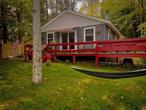 If there is anything better than waking up and drinking a cup of coffee in your Adirondack chair on your private dock overlooking a still, quiet mountain lake we just haven&rsquo;t found it yet. This three bedroom, one bath lakefront cottage is as charming as it is practical. The flat, level lakefront makes it feel that the lake is simply an extension of your back yard. The interior is just what you would think of in an upstate lake front cabin. Simple, efficient and inviting. It feels as if you&rsquo;re leaving it all behind for a simpler, better time where you can enjoy that coffee on the dock, take a kayak and go fishing at your leisure, play card games at the dining table and end the night around a campfire with your friends and family. Lake Muskoday is a private, non motorboat lake with an excellent sense of community. Don&rsquo;t miss your opportunity to own a piece of real estate that is not only an investment, it creates fond memories that last lifetimes. Life begins where the land meets the water.