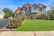 Welcome to 21 Bird Lane, a stunning 5-bedroom Colonial with mother/daughter potential. With upgraded vinyl siding and Andersen windows, the home exudes curb appeal. Enter inside to a freshly painted first floor featuring wood and Pergo floors, new interior doors, and moldings. The primary bedroom is a spacious 12x28 retreat with a large den, and the renovated bath boasts a Jacuzzi tub and separate shower stall. Head outside through sliders to a beautifully landscaped, park-like yard complete with a patio and hot tub-perfect for relaxing. The home also features a large attic for ample storage. Enjoy the comfort of a 200-amp electrical system, an 8-year-old boiler, and oil heating with forced air. Located near Dutch Lane Elementary and the Abe Levitt Baseball Field, this home combines comfort, style, and convenience in a fantastic Hicksville neighborhood. Don&rsquo;t miss out on this rare opportunity!