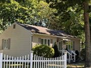 This inviting 2-bedroom, 1-bath ranch is nestled in the heart of Ronkonkoma. Positioned on a corner lot and conveniently close to the LIRR, this home awaits your personal touch.