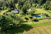 Exquisitely restored 1822 farmhouse on 50+ acres in Millbrook, NY, blending historic charm and modern luxury. This stunning home features sun-filled rooms, original hardwood floors, and six fireplaces. The gourmet kitchen is equipped with marble countertops, high-end appliances, a butler&rsquo;s pantry, and a fireplace. A beautiful sunroom with floor-to-ceiling windows and marble floors connects seamlessly to the outdoors. Additional highlights include a powder room, mudroom, and library with an en-suite bath. The upstairs primary suite boasts a private porch, fireplace, walk-in closet, and a luxurious bath with a brass soaking tub and marble shower. Three additional bedrooms all have en-suite baths. The meticulously landscaped grounds feature a serene gunite pool with breathtaking views. Completing the estate is a three-car garage. A rare opportunity to own a historic Millbrook treasure. 3 lots equaling 51.86 acres.