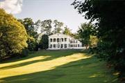 Perched high on a hill, presiding over a rolling green expanse to the mighty Hudson River below, sits a grand and exquisite Greek revival home known as Aberdeen. Built in 1828 in West Park, a hamlet of Esopus NY, Aberdeen sits amongst many glorious, historic river front homes built by some of America&rsquo;s most notable families. Considered to be Ulster Counties most impressive Greek Revival house, every original detail of this architectural beauty has been carefully restored and respected, while being elegantly updated with luxurious custom fixtures and materials of the highest quality, all referencing the homes rich history. As impressive as the interior of this 6 bedroom, 4.5 bathroom home is-the experience of stepping out onto the rear portico with its two storied fluted ionic colonnade- taking in the river views and the Vanderbilt Mansion perfectly framed out across the water, is simply breathtaking. There are 9 private acres in total, comprised of handsome stone terraces with stairs down to rolling lawn, open fields and wooded areas, all leading to the waterfront with over 400 feet of rare private river access. Upon entering the home one is struck by the grand proportions of the rooms, the remarkable refinement of the original details that have impressed for hundreds of years and the lovely light throughout. To the right is a double parlor, featuring lovingly restored cast plaster crown moldings, and 2 of the 9 working fireplaces in the home- four of them outfitted with gas. To the left is the exceptional formal dining room with working fireplace and a door to the winding back stair leads from the attic level down to the beautifully restored basement with a discrete laundry room and a romantic wine cellar and tasting room. The enormous eat-in kitchen wing of the home is accessed via a handsome butler&rsquo;s pantry with exposed beams, custom cabinetry and a wood fired oven built into the wall. The chef&rsquo;s kitchen is a wonderful mix of rustic original elements, contrasting with high end modern appliances, luxurious marble counter tops, custom cabinetry and two sinks. French doors open onto a covered porch and bluestone terrace beyond. A serene study lined with book shelves and a curved formal central stair that winds its way to the second floor complete the ground level. Upstairs, four bedrooms are accessed via a wide central gallery that extends from the front of the house to the back. Just as it does on the first floor, the Hudson River features prominently and comes in and out of view as one passes from room to room. An amply sized primary bedroom suite sets a luxurious tone with a gas fireplace and quietly opulent bath en-suite featuring gorgeous floor to ceiling tile work, claw foot tub, massive overhead rain shower and a gorgeous double marble sink with handsome brass fixtures throughout. There are three other beautifully appointed bedrooms in this central portion of the house which share another similarly appointed bathroom, with direct access to one of the bedrooms. A fifth bedroom and en-suite bathroom is tucked away quietly at the end of the second story wing and accessed through a cozy upstairs den.  The guesthouse is situated opposite the kitchen terrace- accessed via a charming planted parterre-and is comprised of a cathedral ceilinged living room with substantial stone fireplace at one end, a wall of floor to ceiling windows looking out to the river, a full bathroom, and another oversized space boasts a kitchenette and walls of glass.. Additionally the property boasts a separate two car garage and adjoining room intended for use as a home gym. All of the systems of the main house and out buildings are either new or have been upgraded to the highest standards with central AC and all modern conveniences throughout. There are also opportunities to build a boat house and dock or even another waterfront home, creating a true family compound. Aberdeen is situated in the heart of the historic Hudson Valley nestled among the Catskill Mountains. Just 15 minutes to the north is the heart of historic Kingston with fine dining, shopping and a multitude of points of interest. Fifteen minutes to the south are both the Amtrak and metro North trains out of Poughkeepsie for easy access to New York City. Still, with all of the luxury, comfort and serenity that this home and grounds provide, you may be tempted to simply stay put and wander down to your private beach where you can kayak, canoe or just revel in the beaut