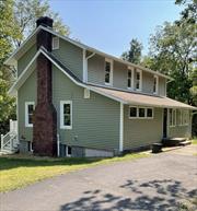 Welcome to this renovated 1924 Colonial gem, nestled on 1.39 acres down a private road in the charming hamlet of Stone Ridge. Step into the heart of the homeâ€”a galley kitchen featuring brand-new countertops and cabinets, perfect for culinary creations. With a full bathroom added on the first floor, convenience is at your fingertips. Imagine cozying up by the inviting working fireplace in the living room as the cool fall air settles in, creating the perfect atmosphere for relaxation and warmth.Significant upgrades throughout the home include 12 newly replaced windows, enhanced insulation, and fresh siding, ensuring both comfort and efficiency. The living room opens onto a spacious deck, an ideal spot to unwind and take in the seasonal views as the leaves change.Venture upstairs to discover two comfortable bedrooms, a newly renovated bathroom, and a versatile small room with a window that could serve as a cozy office or additional storage space.The walkout basement offers utility access, UV light, and washer and dryer hookups for added convenience.Situated just moments from scenic bike and rail trails, the stunning Mohonk Mountain, historic Kingston, and major shopping areas, this home offers privacy and accessibility Additional Information: HeatingFuel:Oil Above Ground,