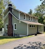Welcome to this renovated 1924 Colonial gem, nestled on 1.39 acres down a private road in the charming hamlet of Stone Ridge. Step into the heart of the homeâ€”a galley kitchen featuring brand-new countertops and cabinets, perfect for culinary creations. With a full bathroom added on the first floor, convenience is at your fingertips. Imagine cozying up by the inviting working fireplace this Fall. Still, for now, entertaining friends or relaxing on the expansive deck located off the living room is the thing to do.Significant upgrades throughout the home include 12 newly replaced windows, enhanced insulation, and fresh siding, ensuring both comfort and efficiency. Venture upstairs to discover two comfortable bedrooms, a newly renovated bathroom, and a versatile small room with a window that could serve as a cozy office or additional storage space.The walkout basement offers utility access, UV light, and washer and dryer hookups for added convenience.Situated just moments from scenic bike and rail trails, the stunning Mohonk Mountain, historic Kingston, and major shopping areas, this home offers privacy and accessibility.