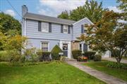 Step into a charming colonial situated on a picturesque, tree-lined street in the heart of the Village of East Williston. The foyer leads to a formal living room with a wood burning fireplace and wide plank inlay oak flooring. The formal dining room is adjacent to the kitchen which opens up to a spacious, yet cozy family room. The first floor is finished off with a bedroom (currently being used as an office) and a powder room. Upstairs there is a primary bedroom with a primary bath, along with two additional bedrooms and a hall bath. Hardwood floors, crown moulding, CAC, full basement, walk-up attic, 2 car garage, gas heat and separate hot water heater are some features of this classic home. Located in the Wheatley school district with an amazing location, close to LIRR, shopping, restaurants, schools, library and parks.  This home is a must-see!